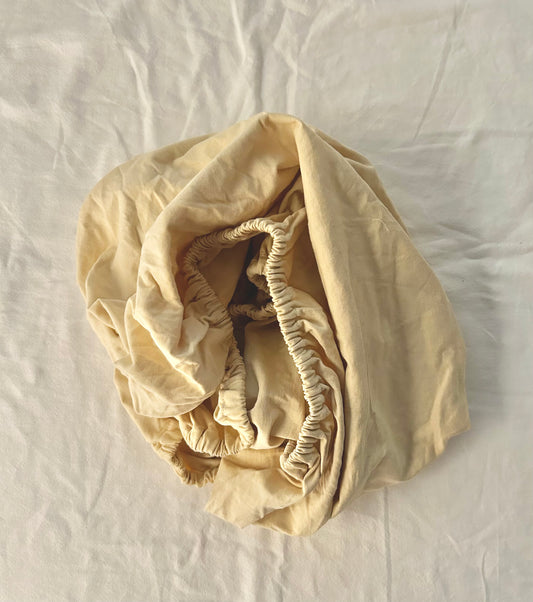 Antique yellow mini crib sheet & basket